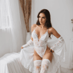 Charming and flirty style showcased by a petite babe in elegant white lace.
